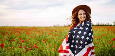 Woman with US Flag, celebrating 4th of July - Top Thai Massage Houston