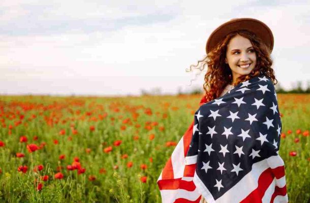 Woman with US Flag, celebrating 4th of July - Top Thai Massage Houston