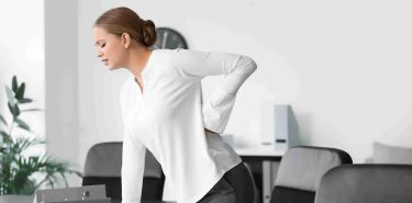 Lower Back Pain, Office Worker in need of therapeutic pain relief - Top Thai Massage Houston